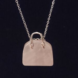 NWOT Rose Quartz Crystal and Gold Handbag Shape Stone Pendant Necklace